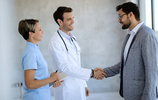 man-shaking-hands-with-woman-man-shaking-her-with-doctor 1